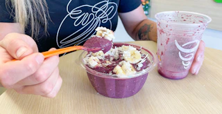 Someone eating an acai bowl at Jamba Juice