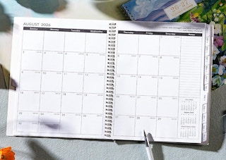 an open planner on a desk