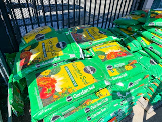 miracle gro stacked on shelf at home depot