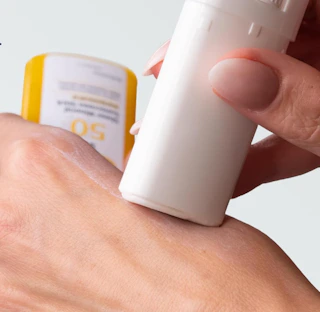a sunscreen stick applied on a hand