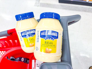2 jars of hellmann's mayo sitting in a target cart