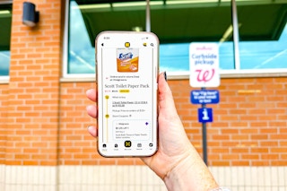 hand holding a smartphone displaying a kcl 1-clip coupon deal