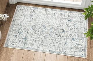Lifestyle image of area rug by door inside home