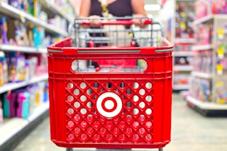 a person pushing a target cart in store