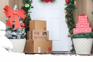 a stack of target boxes on winter doorstep