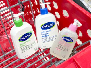 3 cetaphil skin care items sitting in a target cart