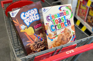 cocoa puffs and cinnamon toast crunch cereals in a cvs cart