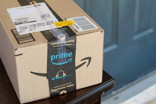 person opening an amazon box