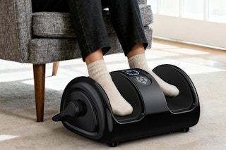 a woman using a foot massager
