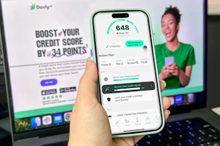 hand holding smartphone looking at a website