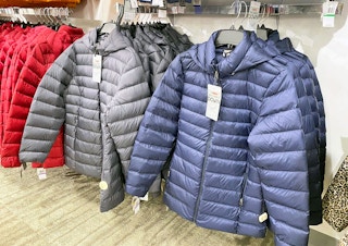 display of puffer coats in store at Macy's
